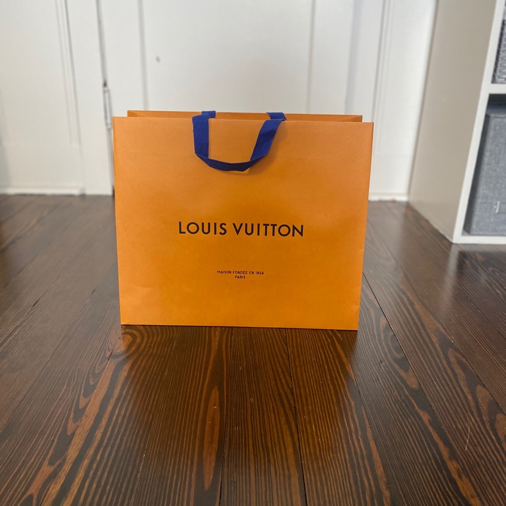 Authentic Louis Vuitton, empty shopping bag.